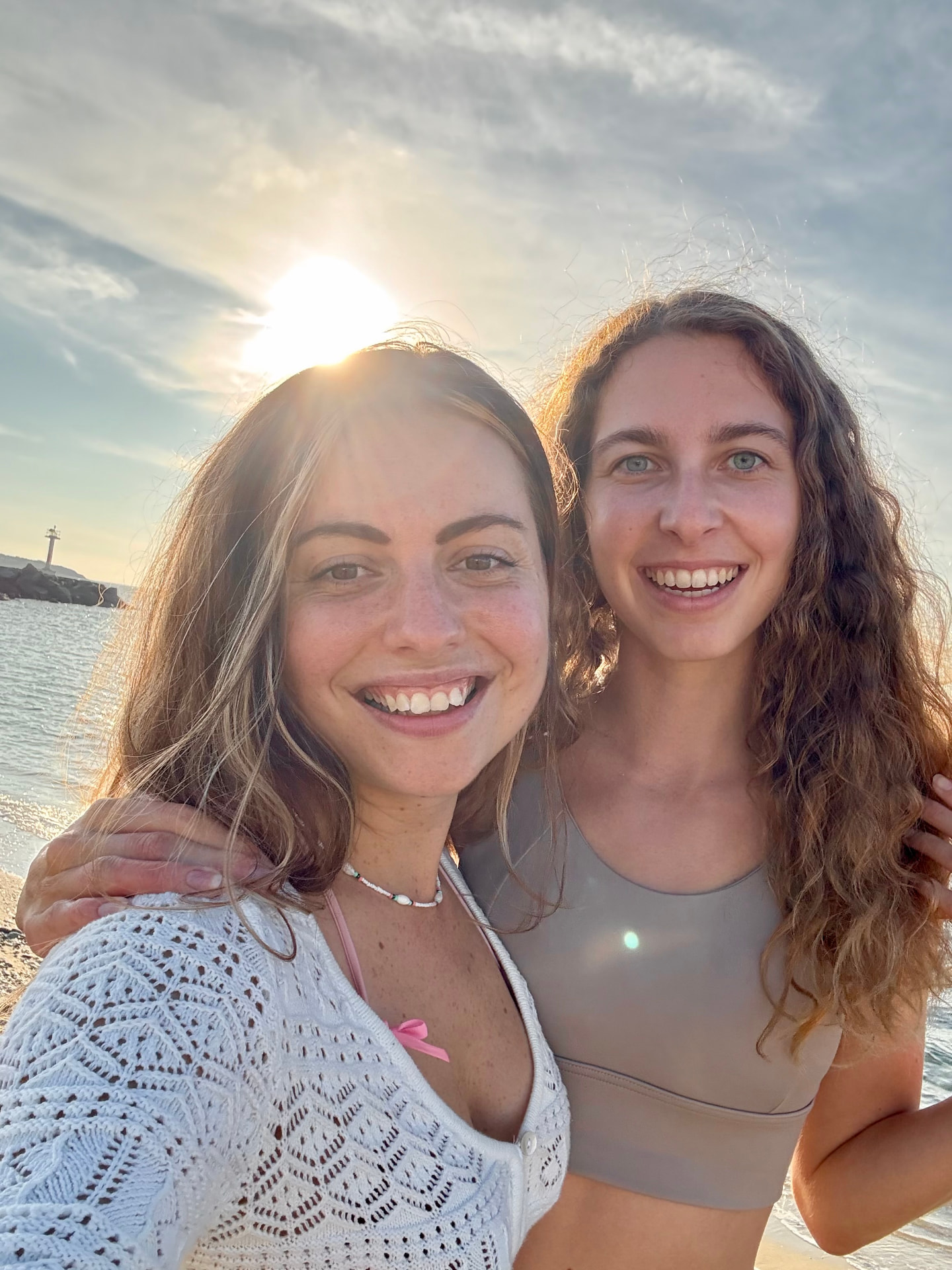 Lucia with a client at sunset by the water